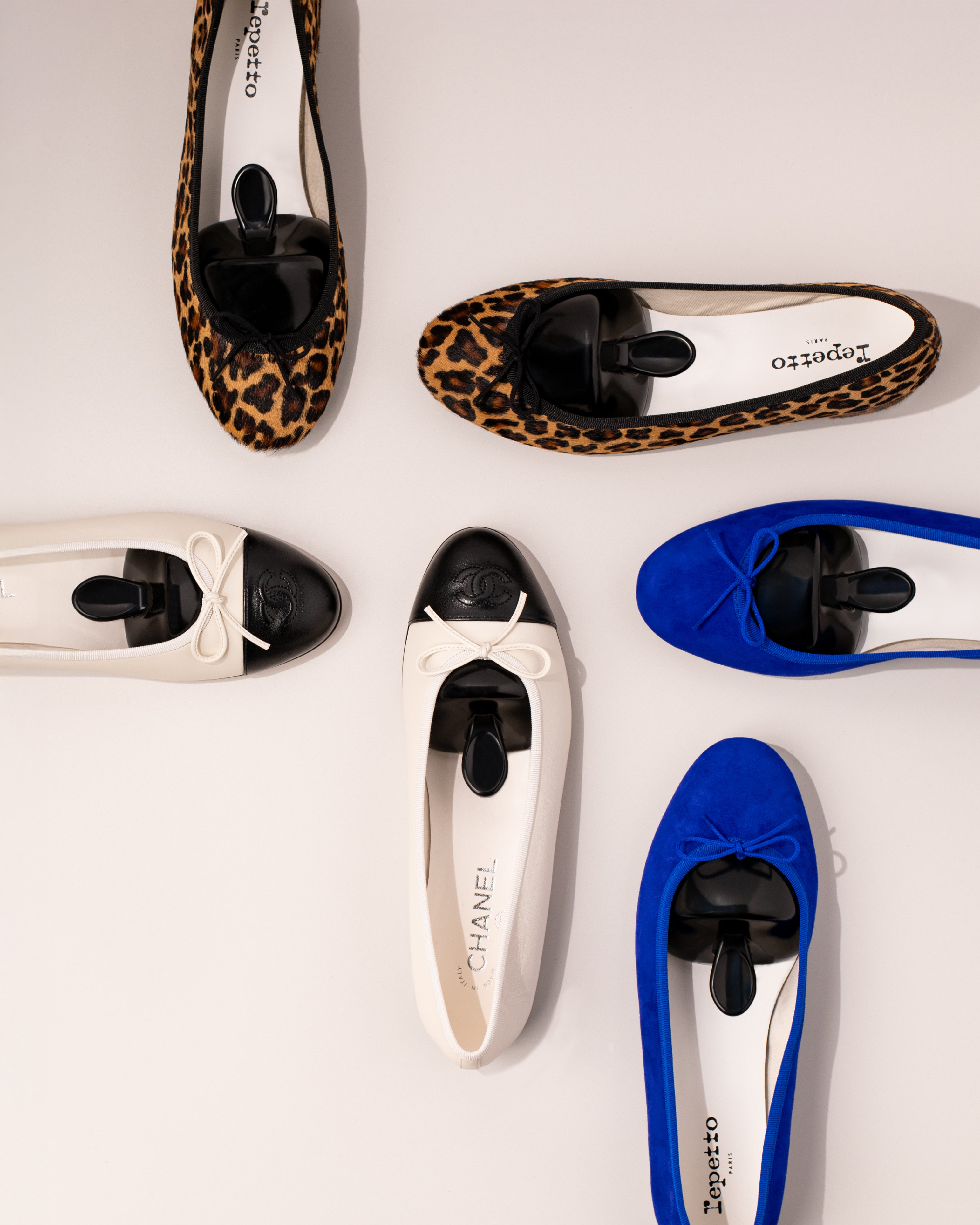 popins womens shoe trees in various pairs of shoes with different designs and colors on a light background